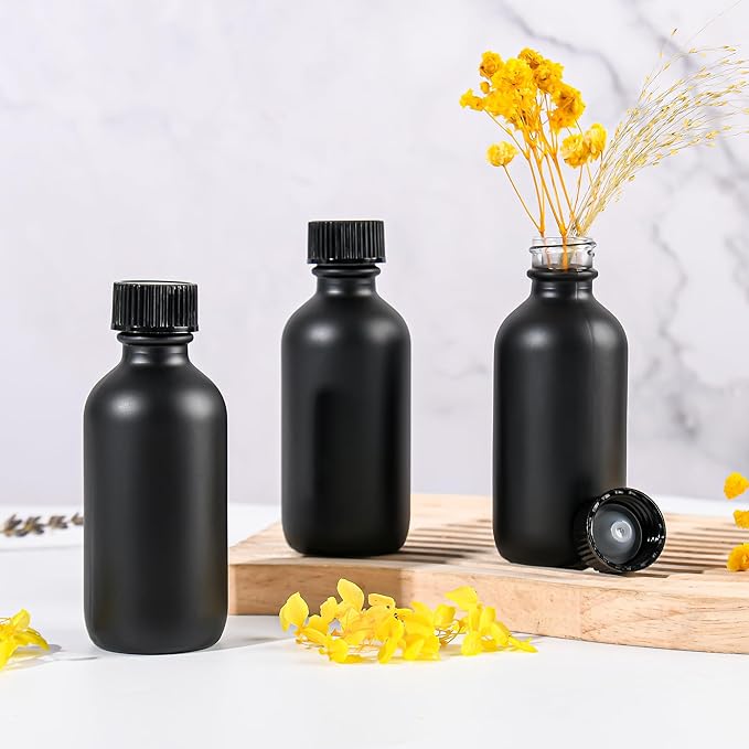 Exlvanto Small Glass Bottles with Lids Boston Round Shot Bottles for Health, Immunity, Ginger Juice, Essential Oils, Potion - Leak Proof Mini Travel Containers (Black Frosted, 2oz-24Pack)